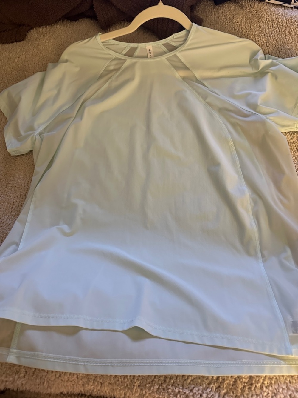 Athleta Light Mint Short Sleeve Performance Tee. Size medium, small spot